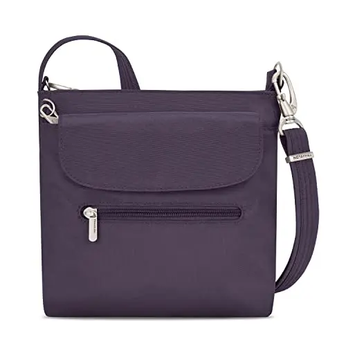 Travelon anti-theft mini shoulder bag in purple showing multiple zippered compartments