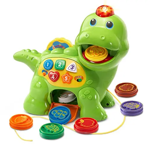 VTech green dinosaur toy with colorful food pieces