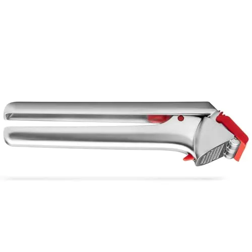 Dreamfarm Garject garlic press in red on a countertop