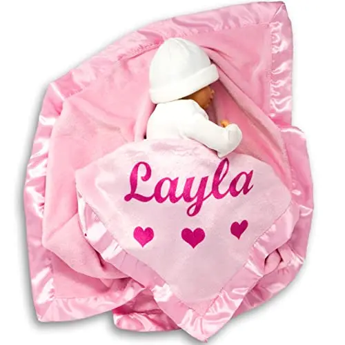 Custom Catch personalized pink fleece baby blanket with satin border for a baby girl.