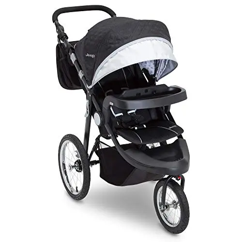 Jeep Cross-Country Sport Plus jogging stroller in Charcoal Galaxy on a rocky road