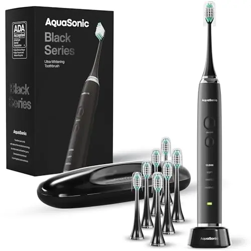 Aquasonic Black Series ultra whitening electric toothbrush with wireless charger, eight brush heads, and hard shell travel case.