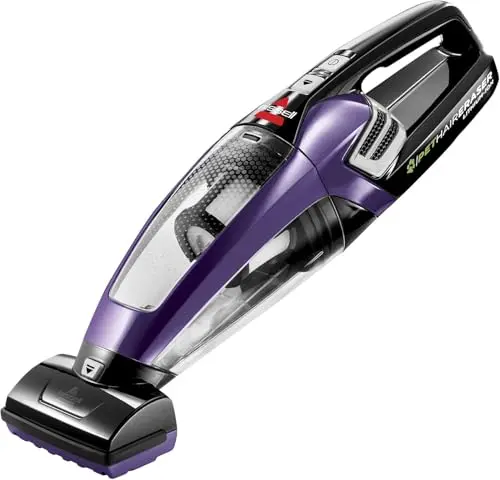 BISSELL purple cordless hand vacuum with motorized brush tool on a sofa.