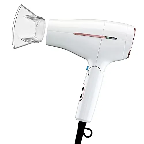 White Conair travel hair dryer with a folding handle and attached concentrator nozzle.