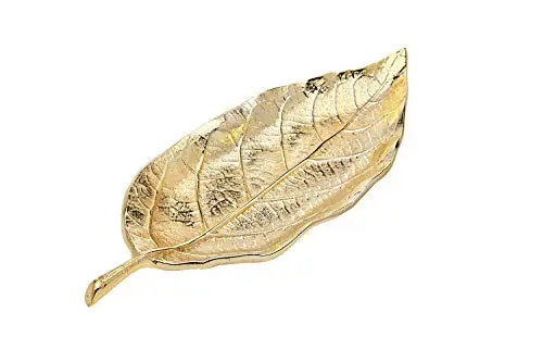 Godinger gold leaf-shaped serving tray on a dresser