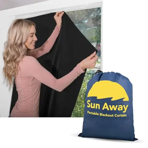 SUN AWAY portable blackout curtain with suction cups on a window