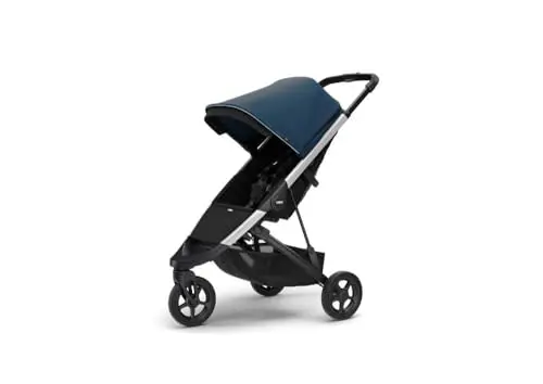Thule Spring Stroller in Majolica Blue, shown in a compact, self-standing fold.