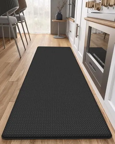 Color&Geometry black anti-fatigue kitchen mat in front of a sink