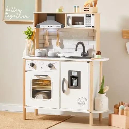 Wooden play kitchen by Tiny Land with range hood, microwave, and accessories