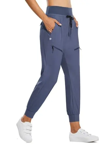 BALEAF women's high-waisted jogger pants with five zipper pockets in blue.