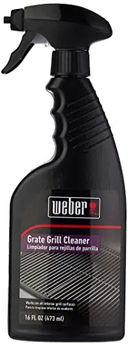 Weber Grill Grate Cleaner spray bottle being used on a grill grate.