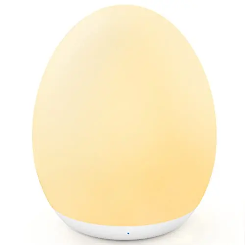 MediAcous white egg-shaped night light glowing with soft colors