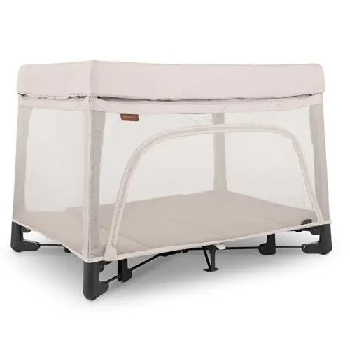 UPPABABY Remi Playard in sand color, set up as a bassinet