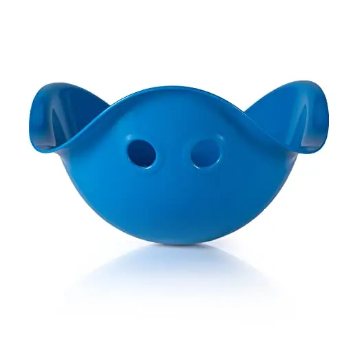 Blue plastic shell-shaped seat called a bilibo, being spun on a wooden floor by a child