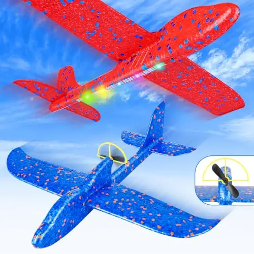 Two white electric foam airplanes with propellers and LED light strips