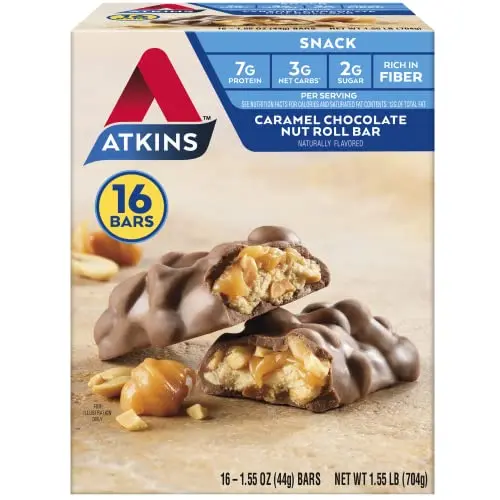 Atkins Caramel Chocolate Nut Roll bar, showing peanuts, caramel, and chocolate coating.