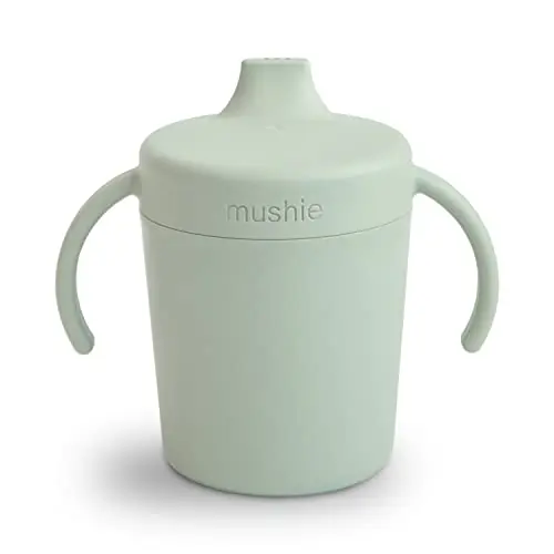 mushie trainer sippy cup with twist-off lid in sage color