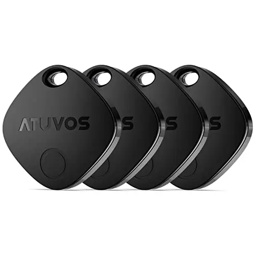 ATUVOS Air Tags four-pack in black, displayed on a travel itinerary.