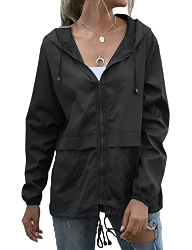 Muzeca women's black packable rain jacket with elastic cuffs and side pockets.