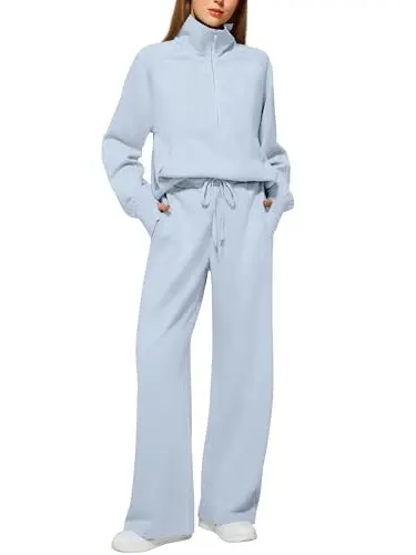 Casly Lamiit oversized half-zip sweatshirt and wide-leg sweatpant set in light blue.