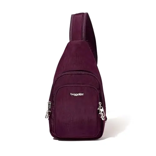 Baggallini anti-theft daytripper sling bag in black with locking zippers and slash-resistant strap