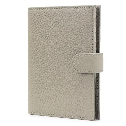 KARMIIR full-grain leather passport wallet in elephant grey, showing card slots, zippered coin pocket, and SIM ejector tool.