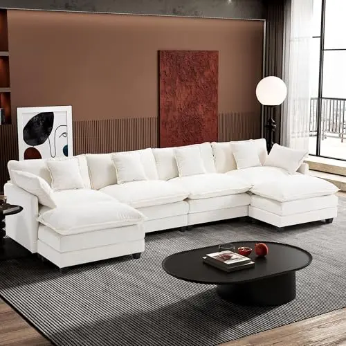 Ihanherry beige U-shaped modular sectional sofa with multiple pillows and ottomans in a modern living room