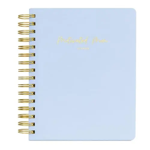 Captured Memories Edition Planner with linen cover open, showing a weekly spread with a section for journaling memories.