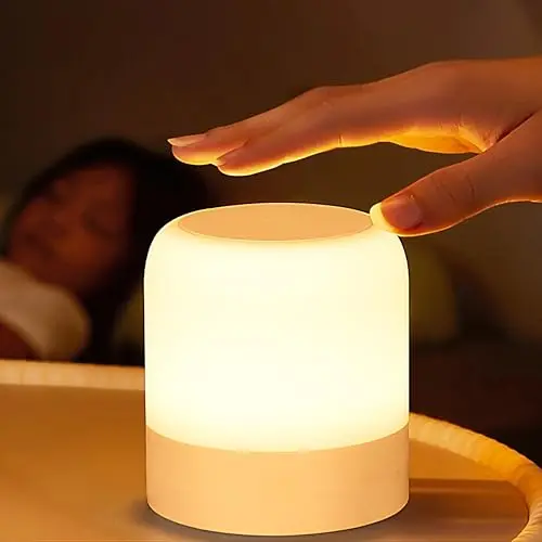 Small FNMYCO egg night light with a handle, glowing warmly