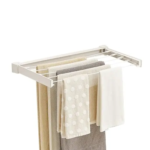 JOOM Wall-Mounted Clothes Drying Rack in white, 27.5 inches wide, folded against wall
