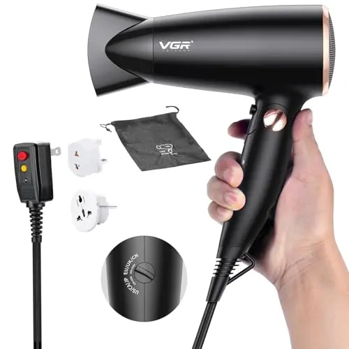 VGR compact black travel hair dryer with folding handle and included plug adapters.