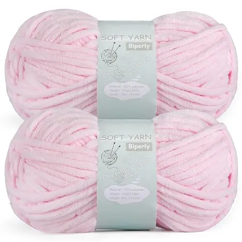 Two skeins of chunky light pink chenille yarn