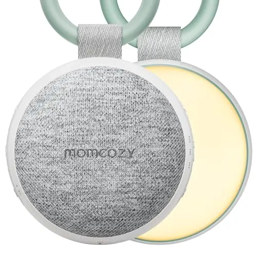 Momcozy portable white noise machine clipped to a stroller handle