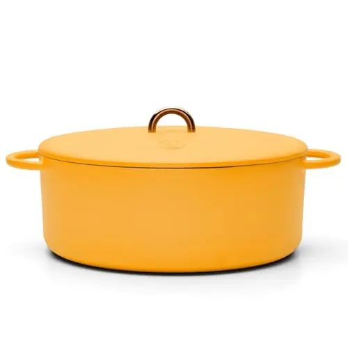 Great Jones Dutchess Dutch oven in mustard color, oval shape with dual handles