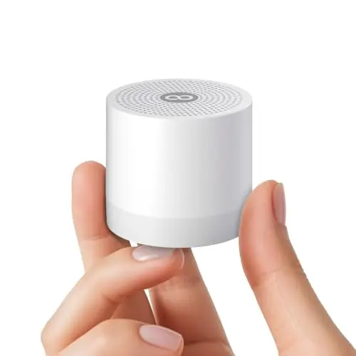 Hushing mini cube-shaped white noise machine with hanging rope