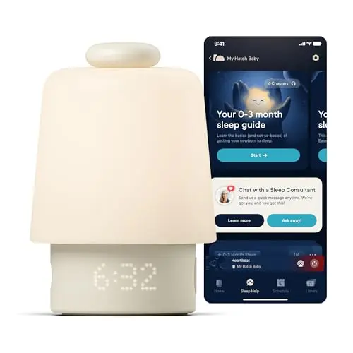 Hatch Rest Baby sound machine and night light in white on a nursery shelf