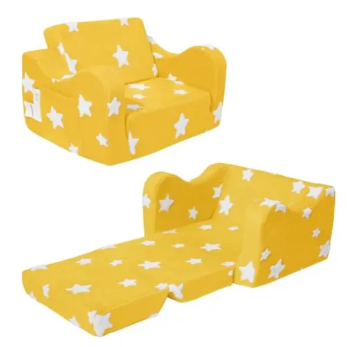 Yellow KokoSelene toddler couch folded out into a lounger bed with star pattern.