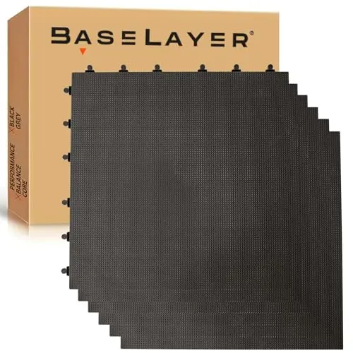 BaseLayer Balance Series black interlocking gym floor tiles in a home gym setup