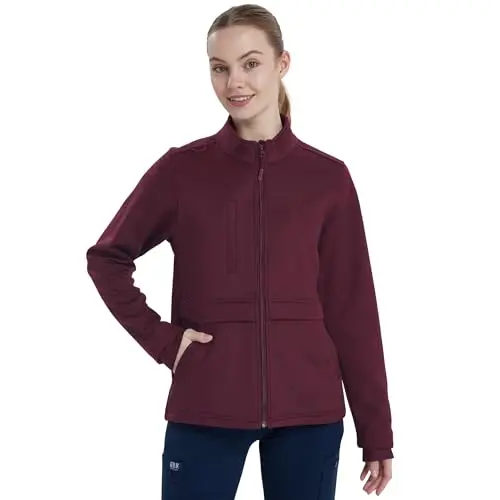 QBK Women's heavyweight bonded fleece scrub jacket with five pockets.